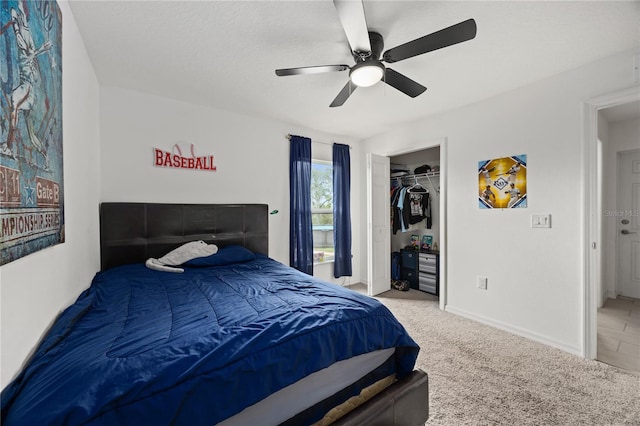 bedroom with light carpet, a closet, and ceiling fan