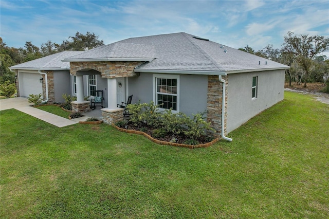 ranch-style house with a front lawn and a garage