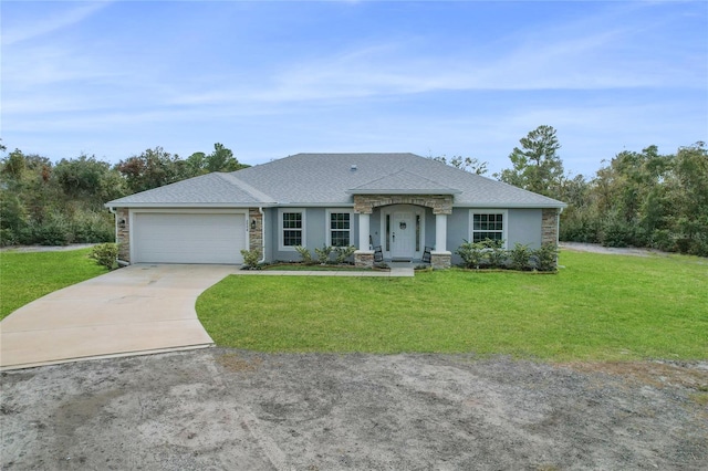 ranch-style house featuring a garage and a front yard