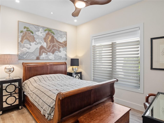 bedroom featuring light hardwood / wood-style flooring and ceiling fan