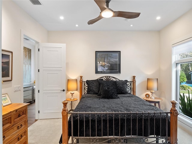 carpeted bedroom with ceiling fan