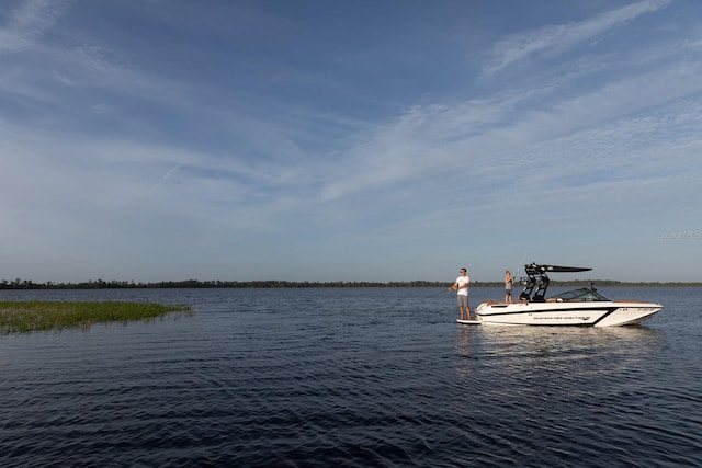 property view of water featuring a dock