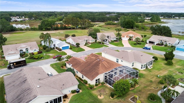 birds eye view of property with a water view