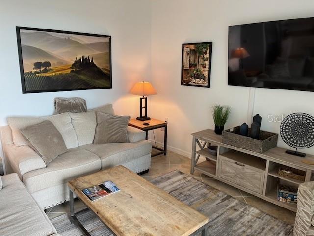 living room featuring light tile patterned floors