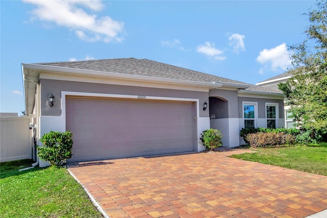 view of front of house with a front lawn and a garage