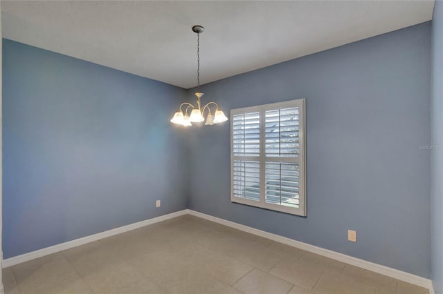 unfurnished room with an inviting chandelier