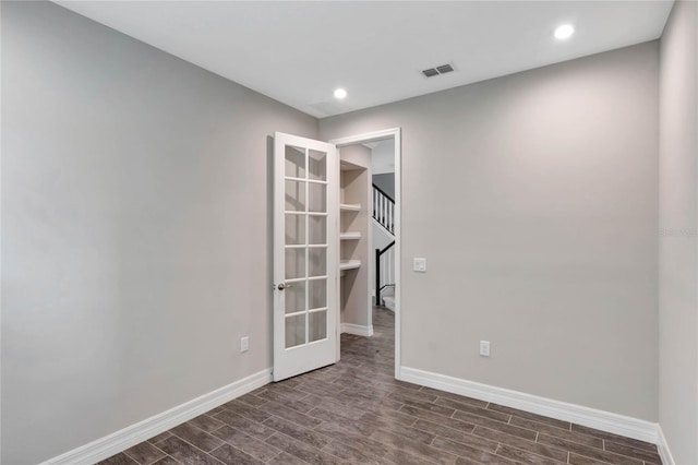 empty room featuring french doors