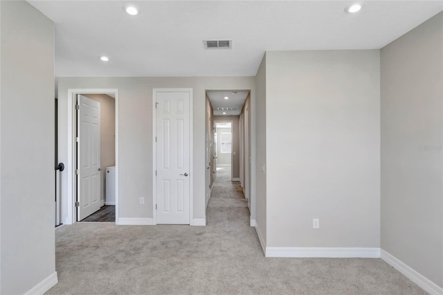 unfurnished bedroom with light carpet