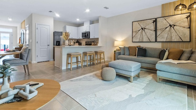 living room with light tile patterned floors