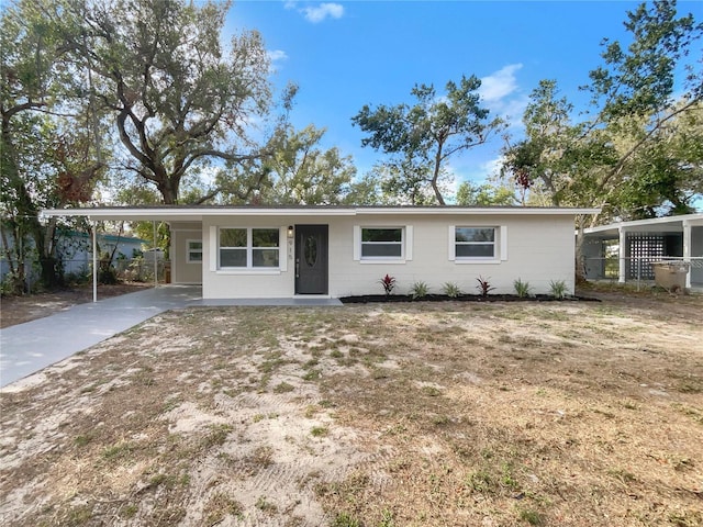 ranch-style house with a carport