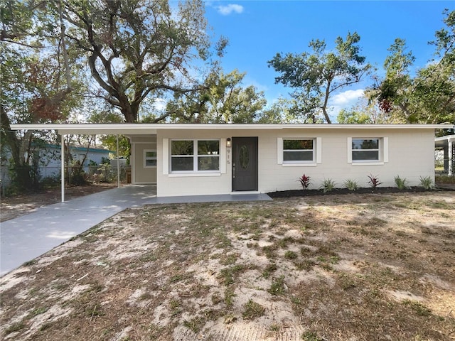 ranch-style house with a carport