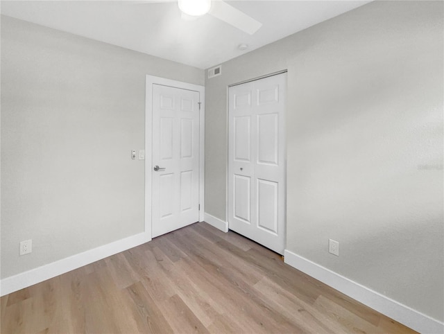 unfurnished bedroom featuring light hardwood / wood-style floors and ceiling fan