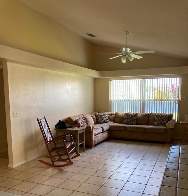 living room with light tile patterned floors, ceiling fan, and a healthy amount of sunlight