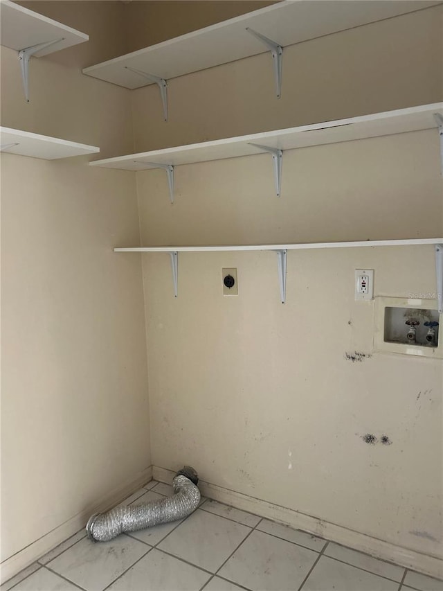 laundry area featuring tile patterned floors, hookup for a washing machine, and hookup for an electric dryer