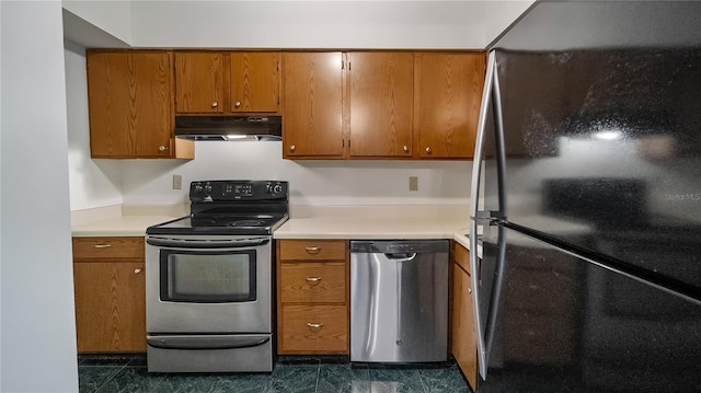 kitchen featuring stainless steel appliances, brown cabinetry, and under cabinet range hood