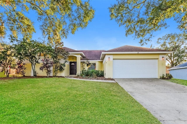 ranch-style house featuring a garage and a front lawn