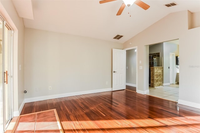 spare room featuring ceiling fan, hardwood / wood-style floors, and lofted ceiling