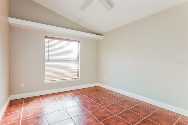 tiled spare room featuring ceiling fan and vaulted ceiling