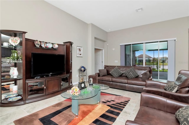 living room with light tile patterned flooring