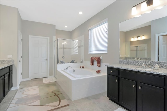 bathroom with tile patterned flooring, vanity, and plus walk in shower