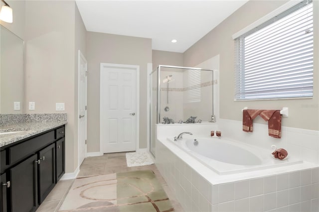 bathroom with tile patterned floors, vanity, and plus walk in shower