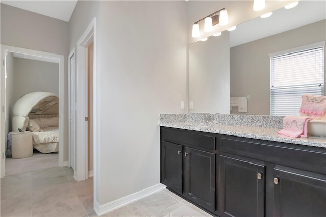 bathroom featuring tile patterned flooring and vanity