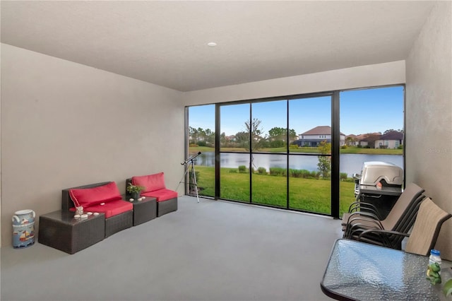 sunroom / solarium with a water view