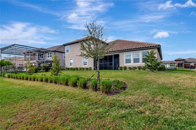 rear view of house with a lawn