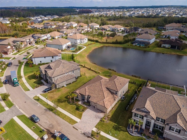 drone / aerial view with a water view