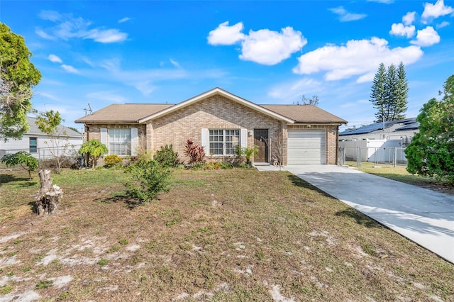 ranch-style home featuring a garage and a front lawn