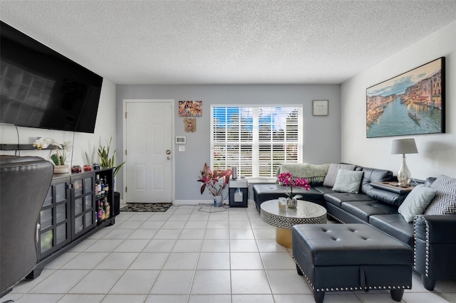 living room with light tile patterned floors and a textured ceiling