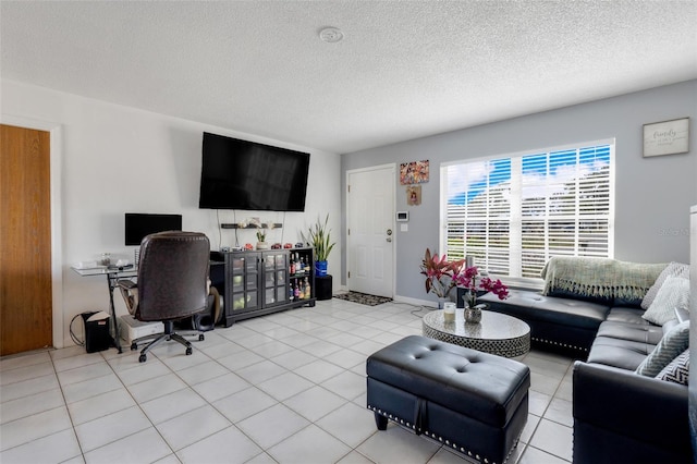 living room featuring light tile patterned floors and a textured ceiling