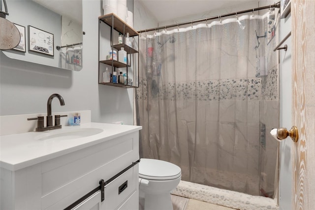 bathroom with a shower with curtain, vanity, and toilet