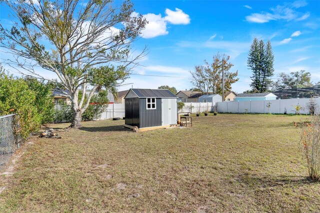 view of yard with a storage shed