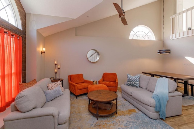 living room featuring hardwood / wood-style floors and high vaulted ceiling