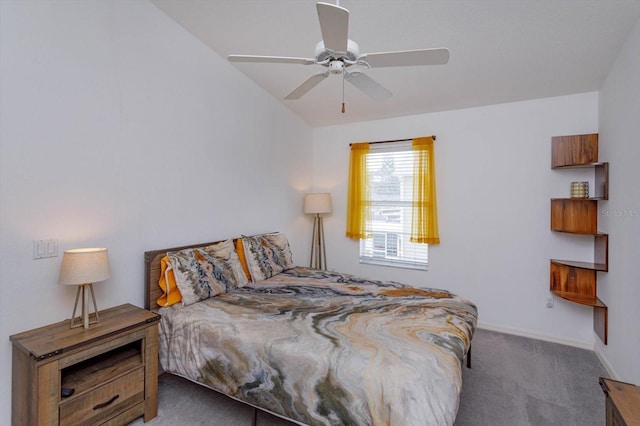 bedroom with ceiling fan and dark colored carpet