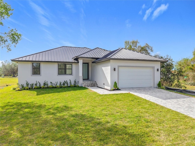 view of front of home featuring a garage and a front lawn