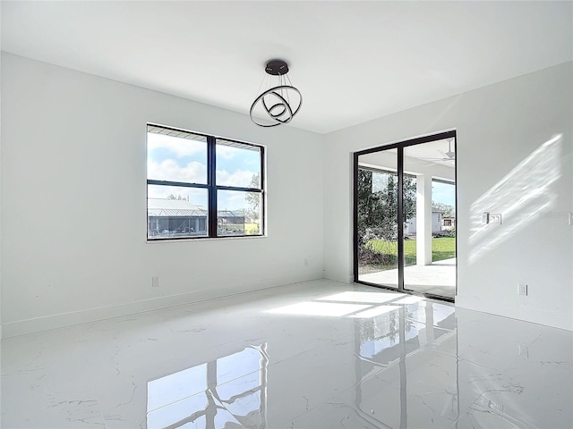 unfurnished room with ceiling fan