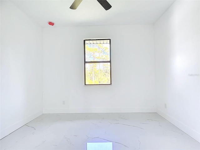 spare room with ceiling fan