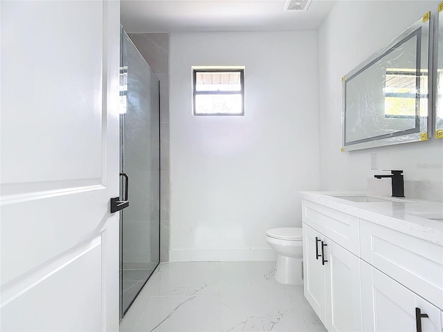 bathroom featuring vanity, toilet, and walk in shower