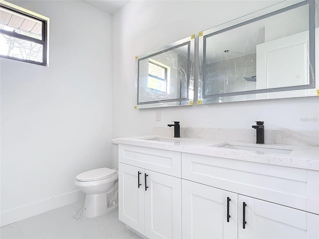 bathroom featuring vanity, toilet, and walk in shower