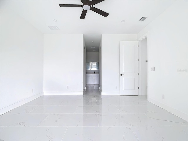 spare room with ceiling fan