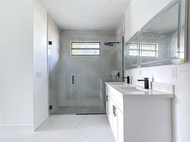 bathroom featuring vanity and a shower with door