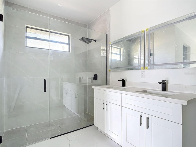 bathroom with vanity and walk in shower