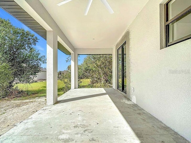 view of patio featuring ceiling fan