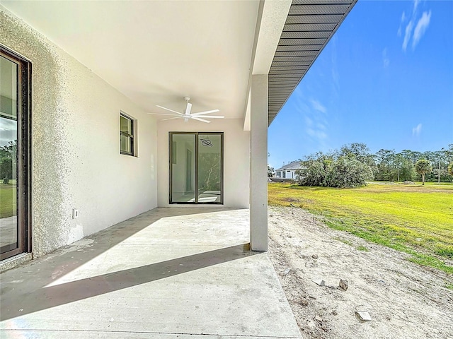 view of patio featuring ceiling fan