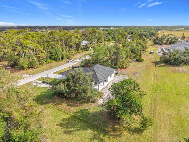 birds eye view of property with a rural view