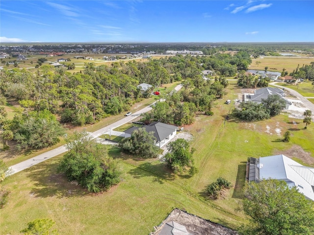 birds eye view of property with a rural view