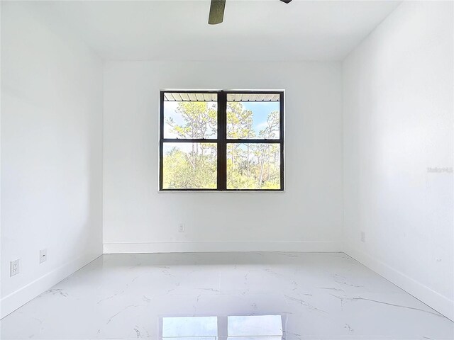 16760 Acapulco Rd, Punta Gorda, FL 33955 - spare room with marble finish flooring and ceiling fan
