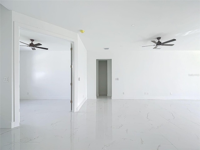 16760 Acapulco Rd, Punta Gorda, FL 33955 - empty room with a ceiling fan and light marble finish floors